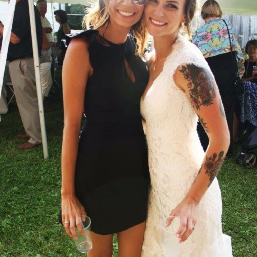 Xoxo Black cocktail dress with gold zipper detail.